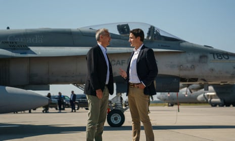 Jens Stoltenberg and Canadian prime minister Justin Trudeau speaking at the Canadian air base in Cold Lake, Alberta