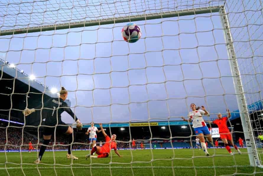 England's Beth Mead scores her second goal.