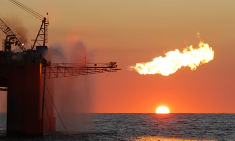 A flare from an ocean-based oil rig burning liquefied natural gas