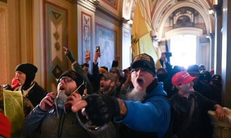 Members of the violent mob in the Capitol building. Police fired teargas as the rioters pushed inside the gleaming white edifice.