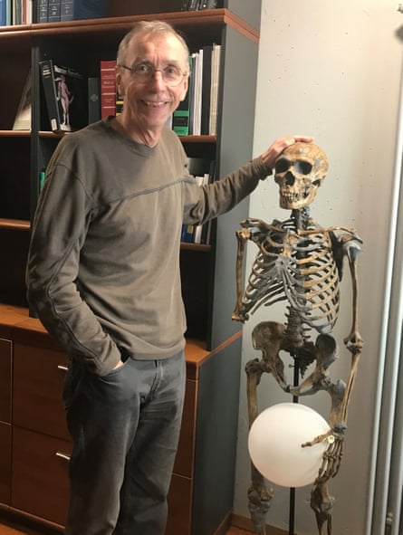 Svante Pääbo with the neanderthal skeleton in his office.
