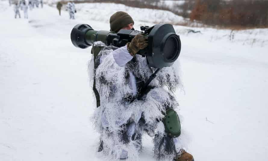 A Ukrainian service member holds a next generation light anti-tank weapon supplied by Britain during drills in the Lviv region Ukraine, in January.