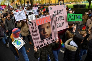 Demonstrators hold up placards during the Fridays for Future march