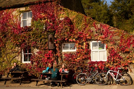 Visitors enjoying the autumn sunshine outside the Craven Arms pub at Appletreewick