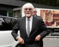Bernie Eccletone in black jacket, sunglasses and white shirt