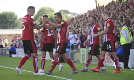 Lincoln City’s players celebrate their second goal against Southend United.