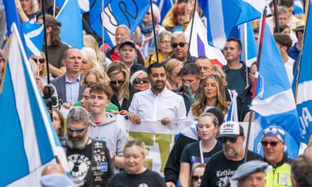 On 2 September 2023 the then first minister of Scotland Humza Yousaf (centre) takes part in a Believe in Scotland march from Edinburgh Castle.
