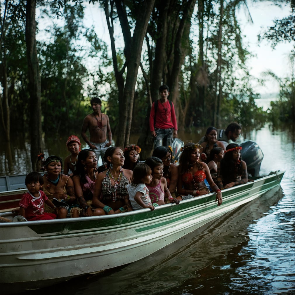 Munduruku indigenous tribe embark down the Tapajos river