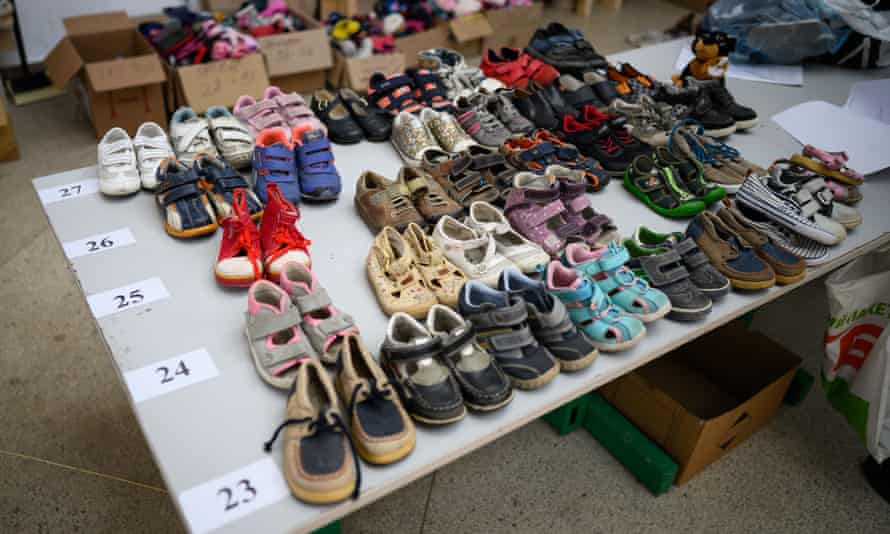 Sized and sorted children’s shoes are seen at a central aid processing and distribution centre in Lviv, Ukraine.