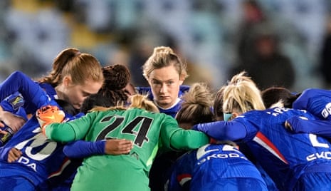 Chelsea players huddle ahead of their League Cup semi-final at Manchester City.