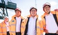 Shadow secretary of state for energy security and net zero Ed Miliband, Labour Party leader Sir Keir Starmer and Scottish Labour leader Anas Sarwar at the Port of Greenock posing in orange high-vis jackets