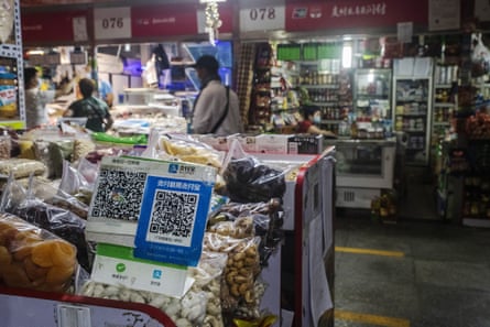 QR codes for digital payment service Alipay at a market stall in Beijing