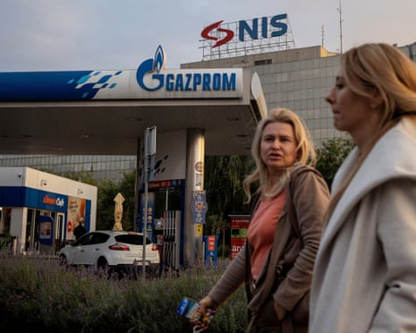 People walk past a petrol station of the Russian oil producer Gazprom Neft, which is the major stakeholder in Serbian oil company NIS, in Belgrade, Serbia, on 8 October 2025.