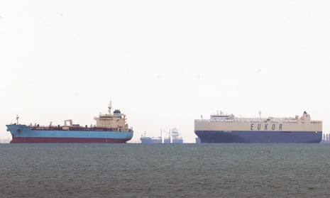 Ships are anchored outside the Suez canal in Ain Shokhna, near Suez, Egypt, 26 March 2021. 