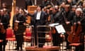 Kazuki Yamada (centre) takes applause from an unseen audience with the City of Birmingham Symphony Orchestra.
