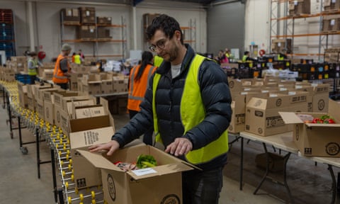Farmers Pick co-founder Josh Ball inspects a fruit and veg box in Melbourne before it’s shipped off to a customer.