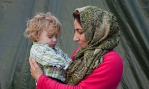 Leyla and her daughter Sara, from Iraq, in the 'Jungle' refugee camp, Calais