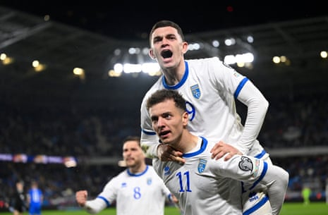 Kosovo's Fisnik Asllani celebrates scoring their second goal with Dion Gallapeni