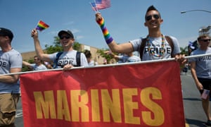 Active duty members of the US military participate in the 2017 San Diego LGBT Pride parade in San Diego, California.