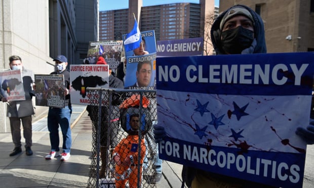 Members of the honduran opposition protest as the trial of Geovanny Fuentes Ramirez in New York City