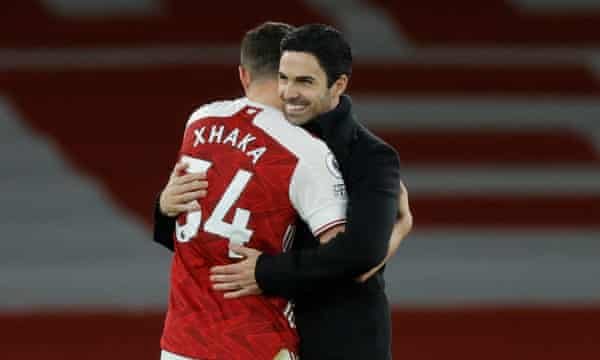 Mikel Arteta and Granit Xhaka embrace after Arsenal’s win over Chelsea on Boxing Day.