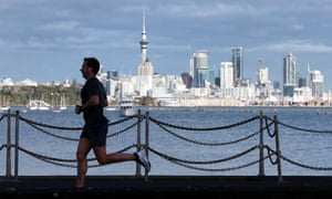 A runner exercises along Tamaki Drive on Auckland’s waterfront on August 24, 2021 in Auckland, New Zealand. Level 4 lockdown restrictions are in place across New Zealand as new COVID-19 cases continue to be recorded. Under COVID-19 Alert Level 4 measures, people are instructed to stay at home in their bubble other than for essential reasons, with travel severely limited. All non-essential businesses are closed, including bars, restaurants, cinemas and playgrounds. All indoor and outdoor events are banned, while schools have switched to online learning. Essential services remain open, including supermarkets and pharmacies. (Photo by Fiona Goodall/Getty Images)