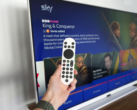 Sky Glass Air remote in front of the TV.