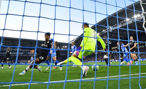 Chelsea's keeper Robert Sanchez can’t stop a shot by Brighton’s Ferdi Kadioglu which opens the scoring.