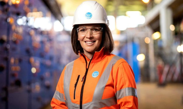 Wearing hard hat and hi-vis jacket