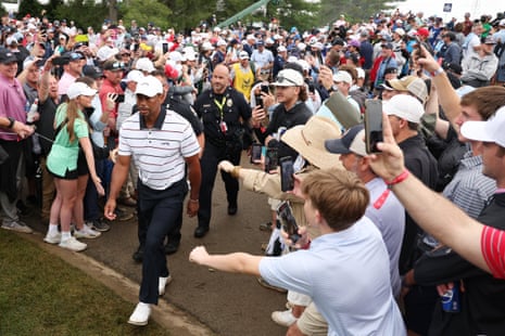 Tiger Woods walks by fans on his way to the eighth tee during the second round of the 2024 PGA Championship at Valhalla Golf Club.