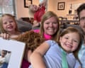 Lauren and Harrison Smith with their daughters and a picture of Benaiah, the Chinese boy they were in the processing of adopting before Beijing announced on 4 September that it was no longer allowing inter country adoptions.