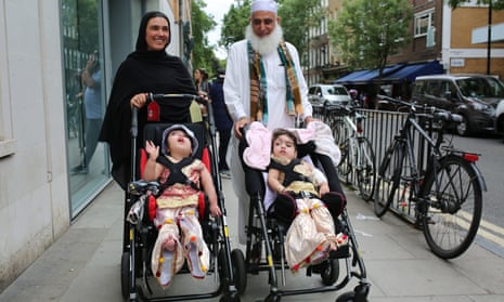 Safa and Marwa Ullah leave hospital with their mother and their grandfather.