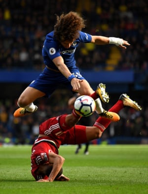 Watford’s comes of worse after the challenge from Chelsea’s David Luiz as Chelsea win 4-2 at Stamford Bridge.