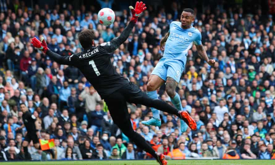 Gabriel Jesus lifts the ball beyond Alisson to put City 2-1 up at half-time.