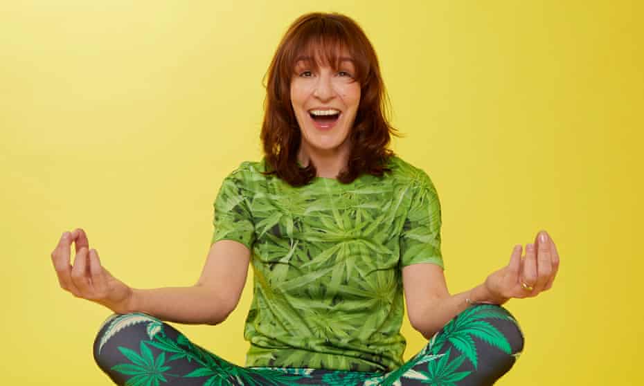 Zoe Williams sitting cross-legged wearing T-shirt and trousers with cannabis leaf