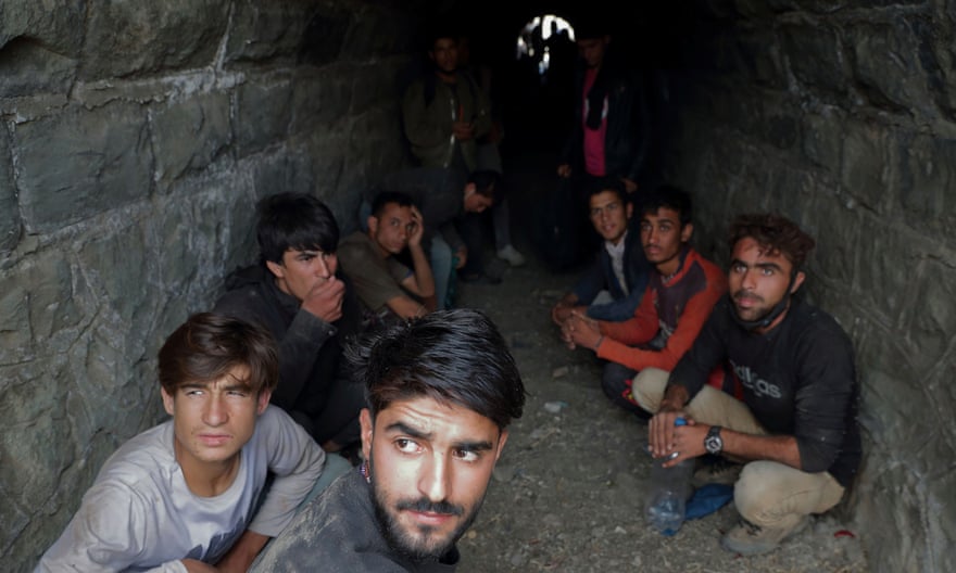 Migrants from Afghanistan hide from security forces after crossing illegally into Turkey from Iran