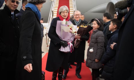 Theresa May and her husband, Philip arrive at Wuhan Tianhe International Airport in Hubei, China.