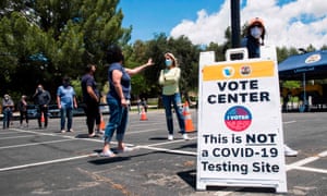 People wait to cast their votes at a polling station for the special election in California’s 25th congressional district, in Santa Clarita.
