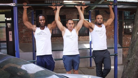 Three men successful vests doing pullups