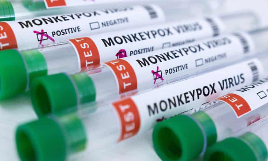 Test tubes labelled "Monkeypox virus positive and negative" 