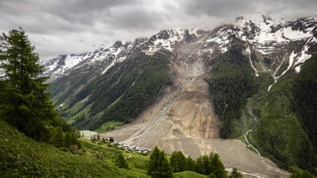 The hamlet of Wyssried is seen above a massive avalanche, triggered by the collapse of the Birch Glacier, as it swept down to the valley floor and buried the village of Blatten, Switzerland, on Thursday, June 5, 2025.