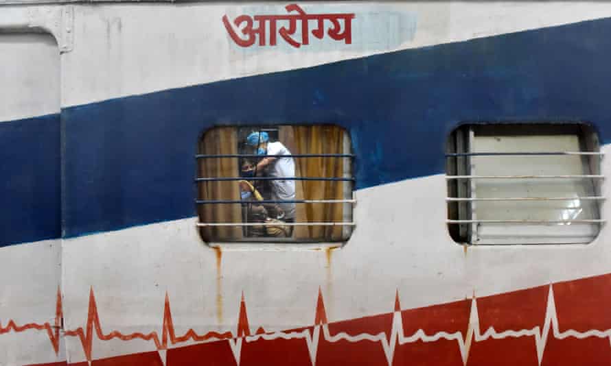 Railway workers being vaccinated on a train in Kolkata yesterday.