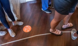 Social distancing is ignored as voters wait in an hours long line to vote at Fulton county’s Park Tavern precinct in the coronavirus-delayed Georgia presidential primary election in Atlanta, Georgia.
