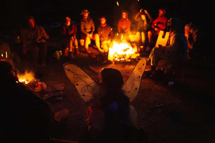 Blockaders hold a meeting around a fire after turning away an old-growth logging crew.