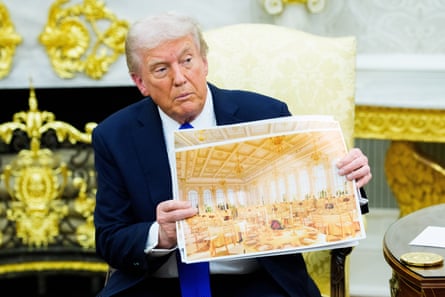 a man in a suit holds a rendering of a ballroom