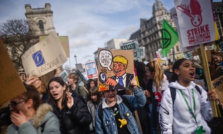 Students take part in a climate march on 14 February in London