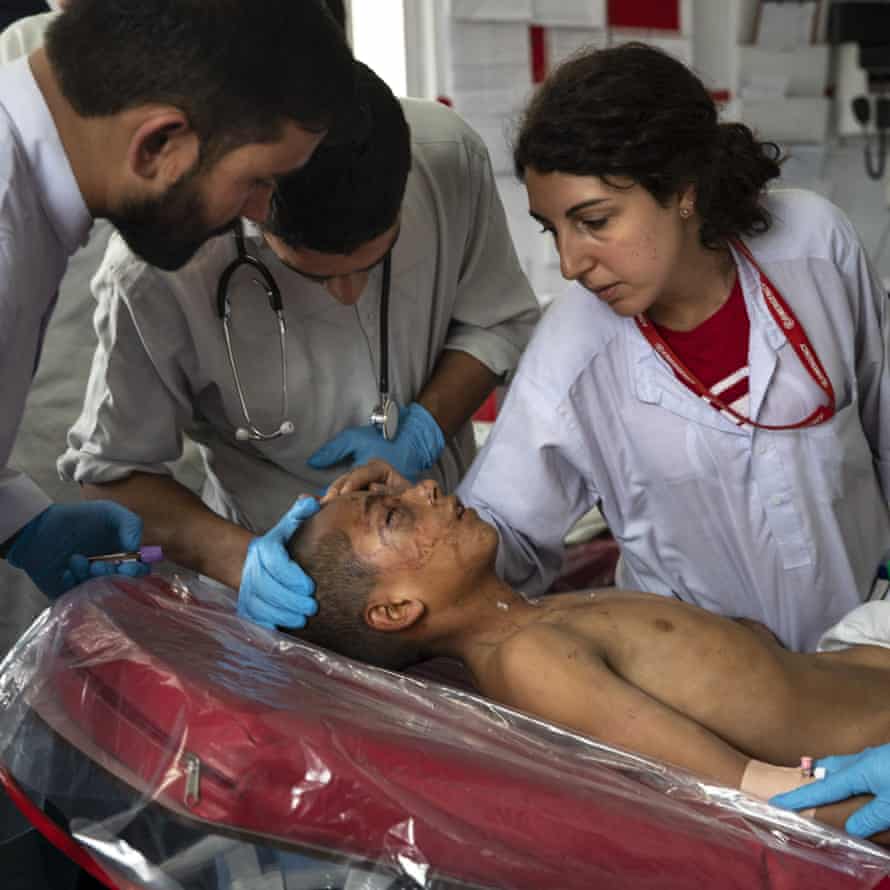 Nurse Roberta Lana examines a trauma patient at the Emergency Surgical Centre for Civilian War Victims in Kabul, Afghanistan, 22 September