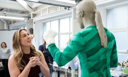 Mary Earps stares at her waxwork in a studio