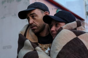 A man and a woman carry a cat during an evacuation from a flooded area. UN aid chief Martin Griffiths told the UN security council that “the sheer magnitude of the catastrophe will only become fully realised in the coming days.”