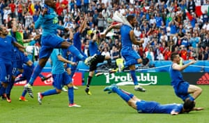 The Italians celebrate at the end of the match.
